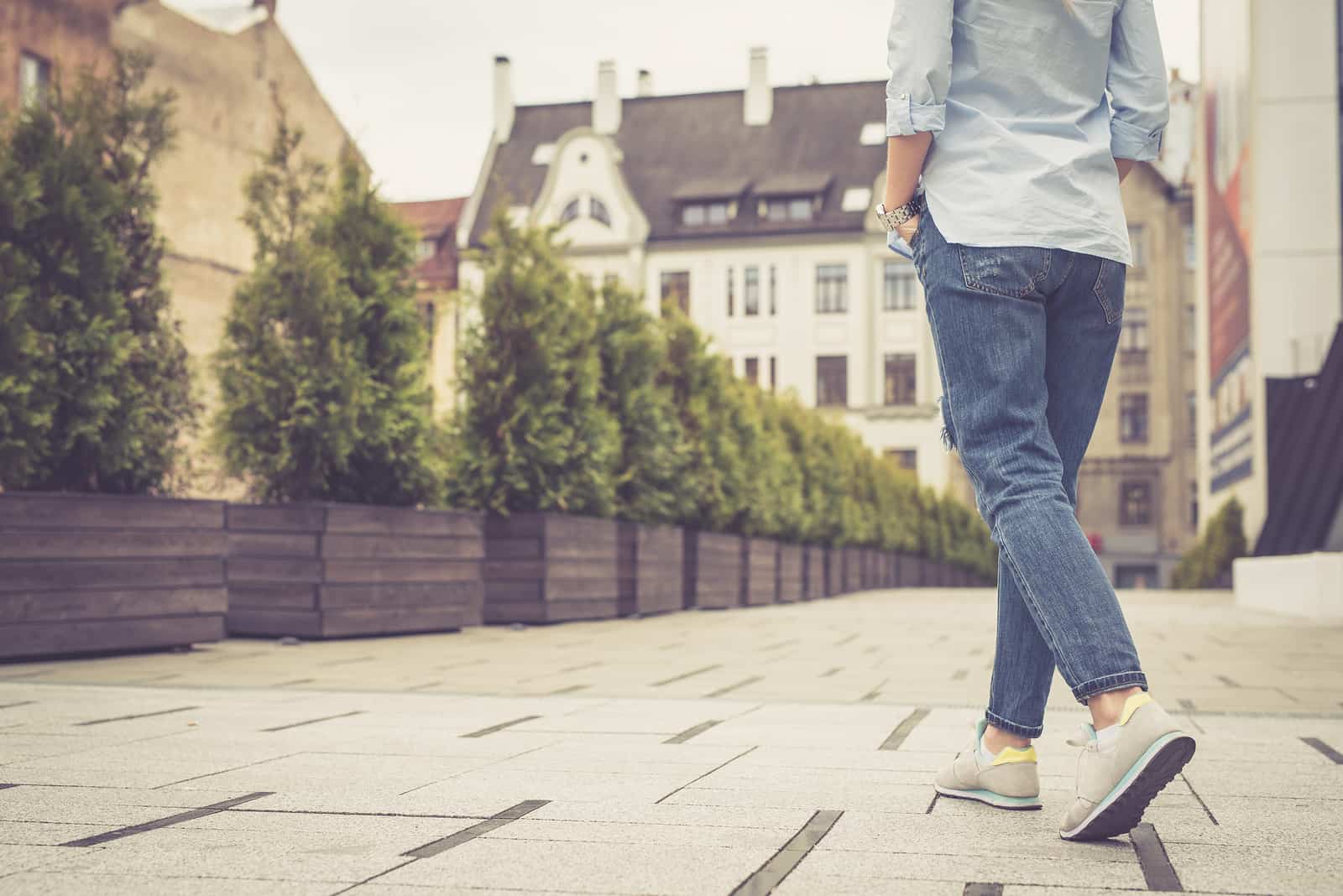 Legs And Feet. Young Girl Walking In The City