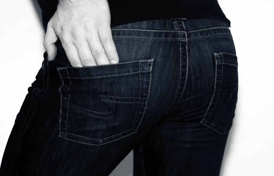 person hand in jeans pocket